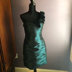 Dark green one shoulder cocktail dress.